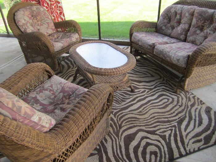 RATTAN TABLE AND SEATING AREA   AREA RUG