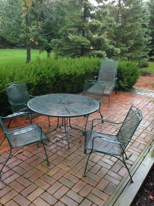 Lyons Shaw 48" wrought iron table, chairs, chaise lounges