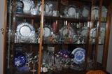 Dining cabinet is full of glass dinnerware