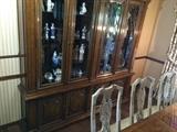 China cabinet filled with Lladro, B&G, Lenox, Orefors and more.