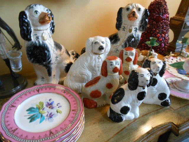 Staffordshire dogs, close up of Old Paris hand decorated plates