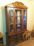 Vintage china cabinet and table with 6 chairs and table pads.