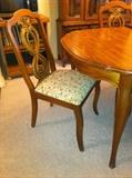 Vintage china cabinet and table with 6 chairs and table pads.