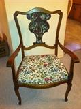 Vintage upholstered wood arm chair.