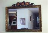 Gold-tone decorative mirror.