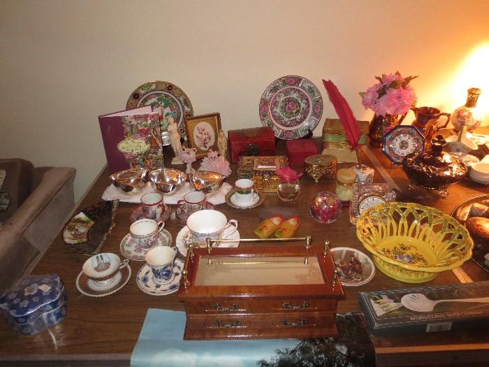 Chinese plates, jewelry box, tea cups, silver serving pieces.