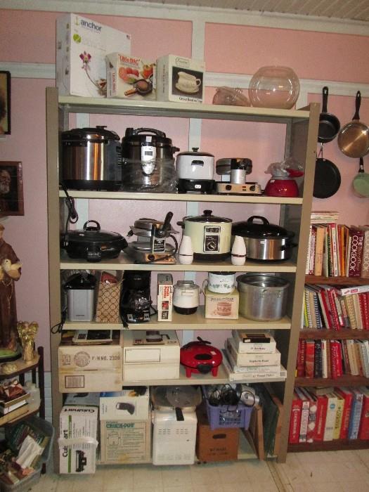 Kitchen counter appliances and many many cook books.