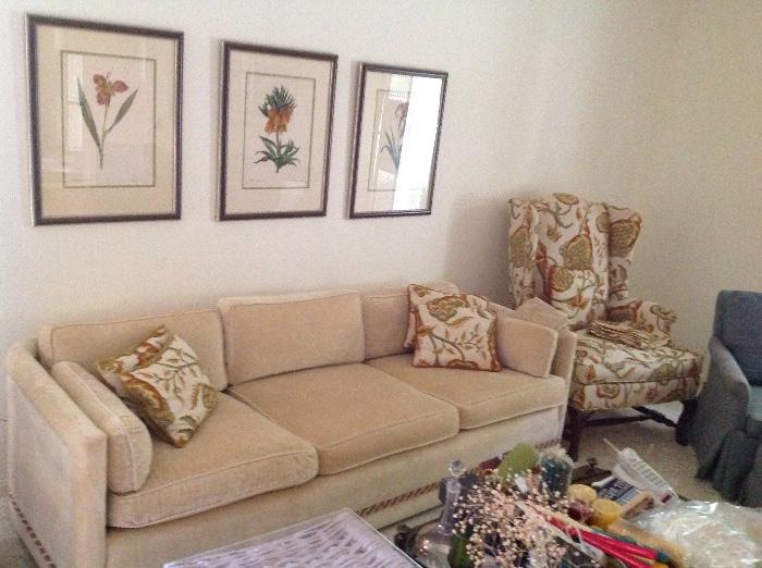creme sofa and floral theme art