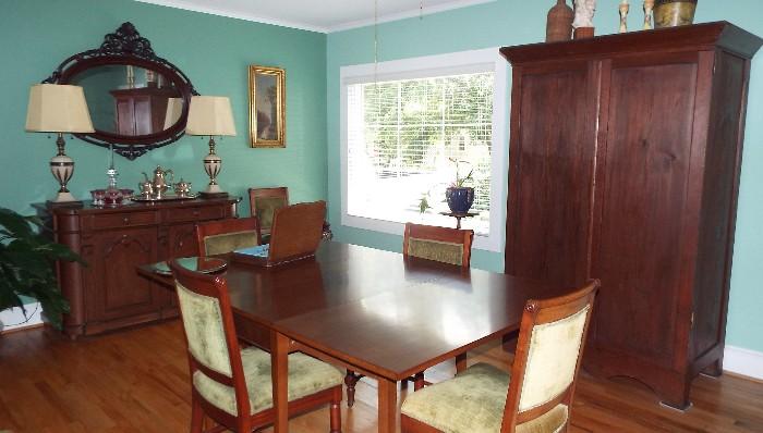 ANTIQUE DINING ROOM WITH SHERATON TABLE, ROLLED BACK VELVET CHAIRS, ANTIQUE CLOTHES PRESS AND BUFFET