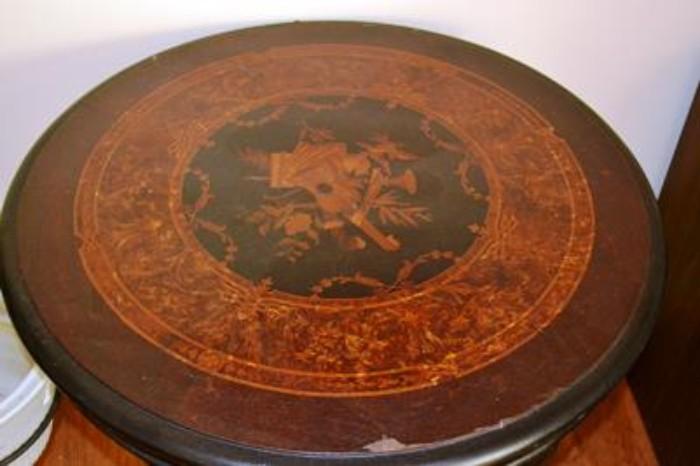 Detail of marquetry top on round Victorian revival table