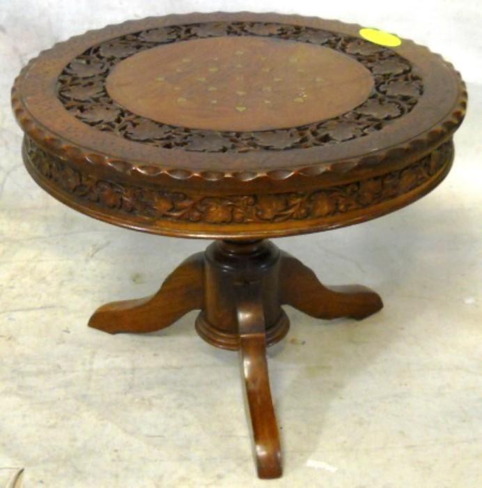 Intricately inlaid and carved drum table