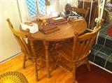 Small Round Oak Dining Table with Fold Down Sides and Two Leaves