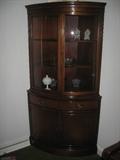 Beautiful Cherry curved glass corner cabinet.