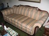 Victorian Style sofa with goose neck trim.