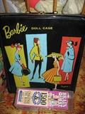 Barbie case with one Barbie and two Ken Dolls