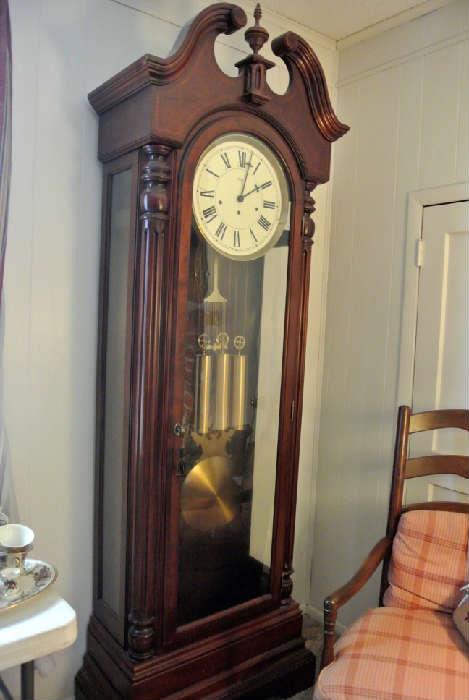 Sligh Grandfather Clock with winding key. Chime sounds soft and beautiful.