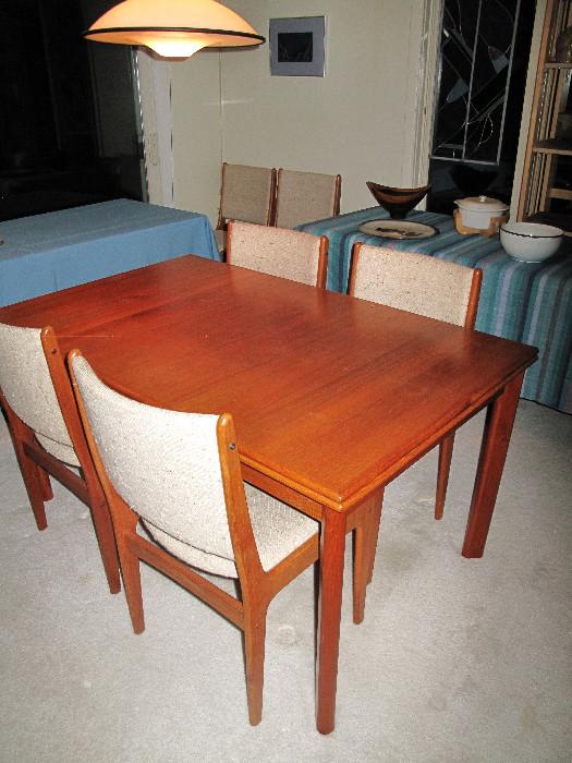 Teak Scandinavia Woodworks seven piece set. Leaves pull out from table ends.