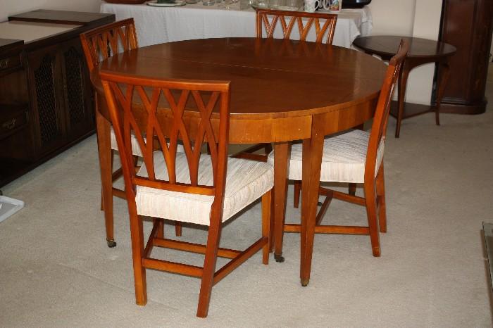 Baker Dining set - 4 chairs are in great shape and 4 need new upholstery - Mid Century, has 8 chairs and 3 leaves and felt cover for top Plus felt to go on the top Goes from 48" to 118" Whoa!