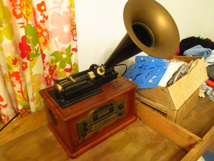 Modern reproduction of old phonograph that use to use those wax tubes, but this one is a radio