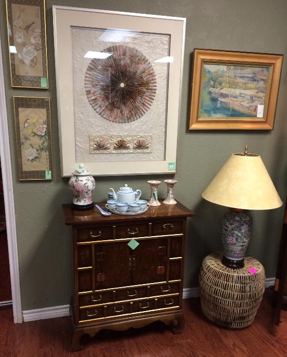 Asian lamp, woven table, sweet painted chest, art in our Asian room.
