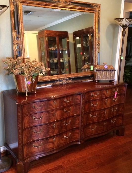Stunning Honduras mahogany crotch dresser, huge mirror with black and gold trim.