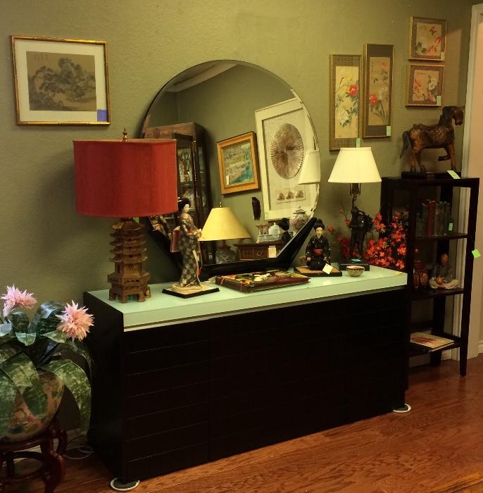 Black console with glass top, art deco mirror, Asian lamp, bronze lamp, art, folding wood bookcase.