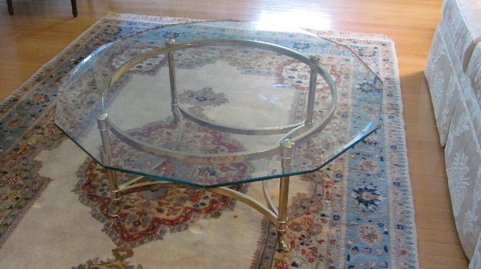 Brass and Glass shaped coffee table. (Rug not in this sale).