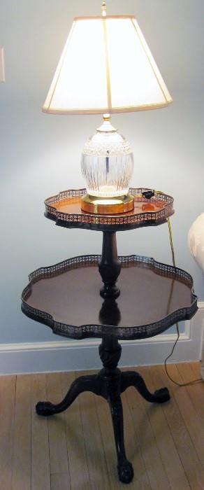 Double tiered table with silvered edges. Most unusual. Waterford lamp.