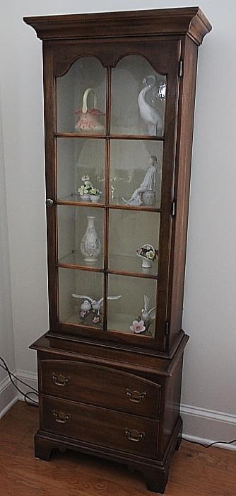 one of a pair of Statton Americana lighted curio cabinets with wavy glass