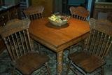 Oak table w/ spun legs (42" x 42") and 10" leaves - 4 pressed back chairs, old butter bowl.