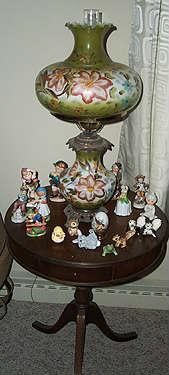 Duncan Phyfe drum top table, GWTW lamp and figurines