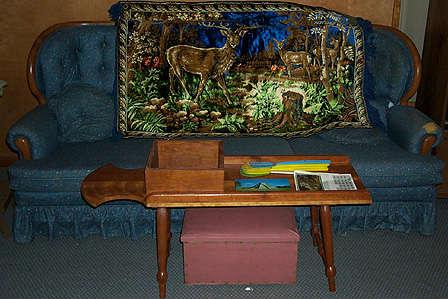 Sofa, coffee table & deer tapestry