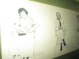 CLOSE UP VIEW OF NORMAN ROCKWELL SIGNED SKETCHES IN ORIGINAL MATTED FRAMES