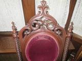 CLOSE UP VIEW OF THIS AMERICAN GOTHIC CARVED WALNUT CHAIR CIRCA 1850