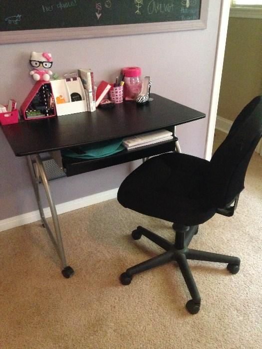black and silver computer desk with chair