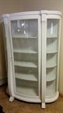 Curved china cabinet with key.