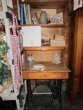 Storage shelves built onto Singer sewing machine base.