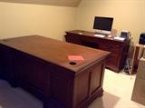 Home office furniture: large desk, smaller desk/credenza, and pair of 7' tall bookcases