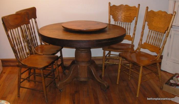 Oak dining Table and 4 chairs, the lazy susan is not attached to the table, it is just sitting on it
