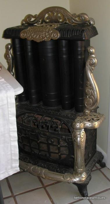  iron /metal fireplace damaged The Estate Stove Company Hamilton Ohio, to verify this is a reproduction stove not antique