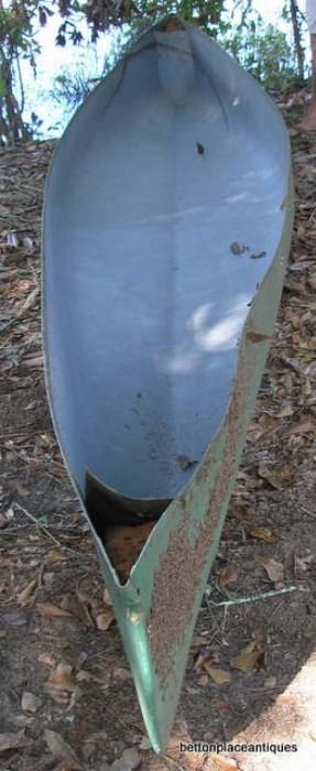 Fiberglass Canoe shell, no inside to this and it does have some damage at front of photo