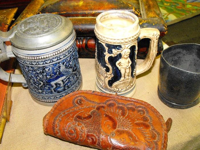 Steins and antique leather pouch
