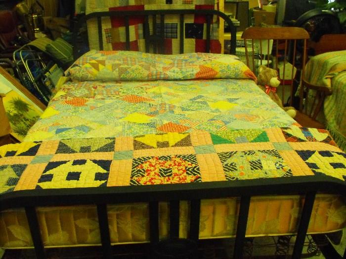 antique iron bed  and quilts