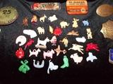 collection of celluloid charms and antique tins
