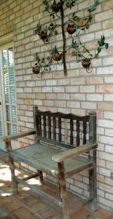 Great wooden bench plus metal wall hanging.