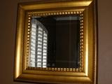 Large beveled mirror in smooth gilt frame, photo does it no justice.