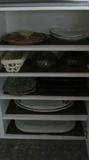 Several platters, plates and trays for serving.
