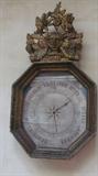 Antique wall decor, image of clock or time piece.