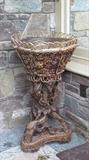 WOOD ROOT PLANT STAND with ornate detail on all sides of plant holder.