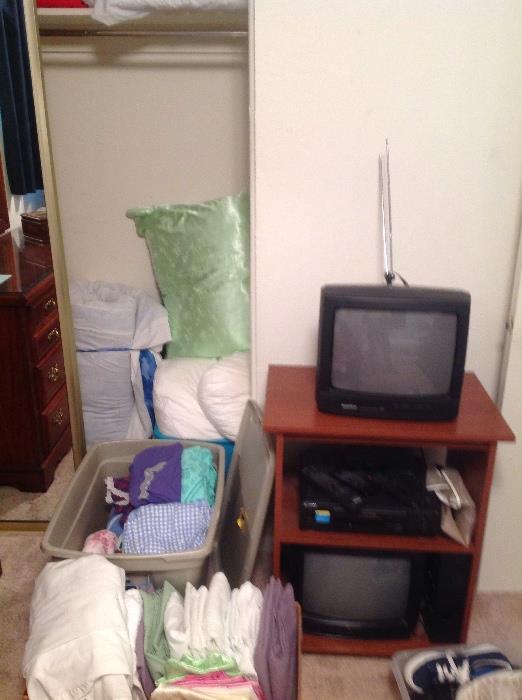 Bedding, nightgowns, pillows, free TV's 